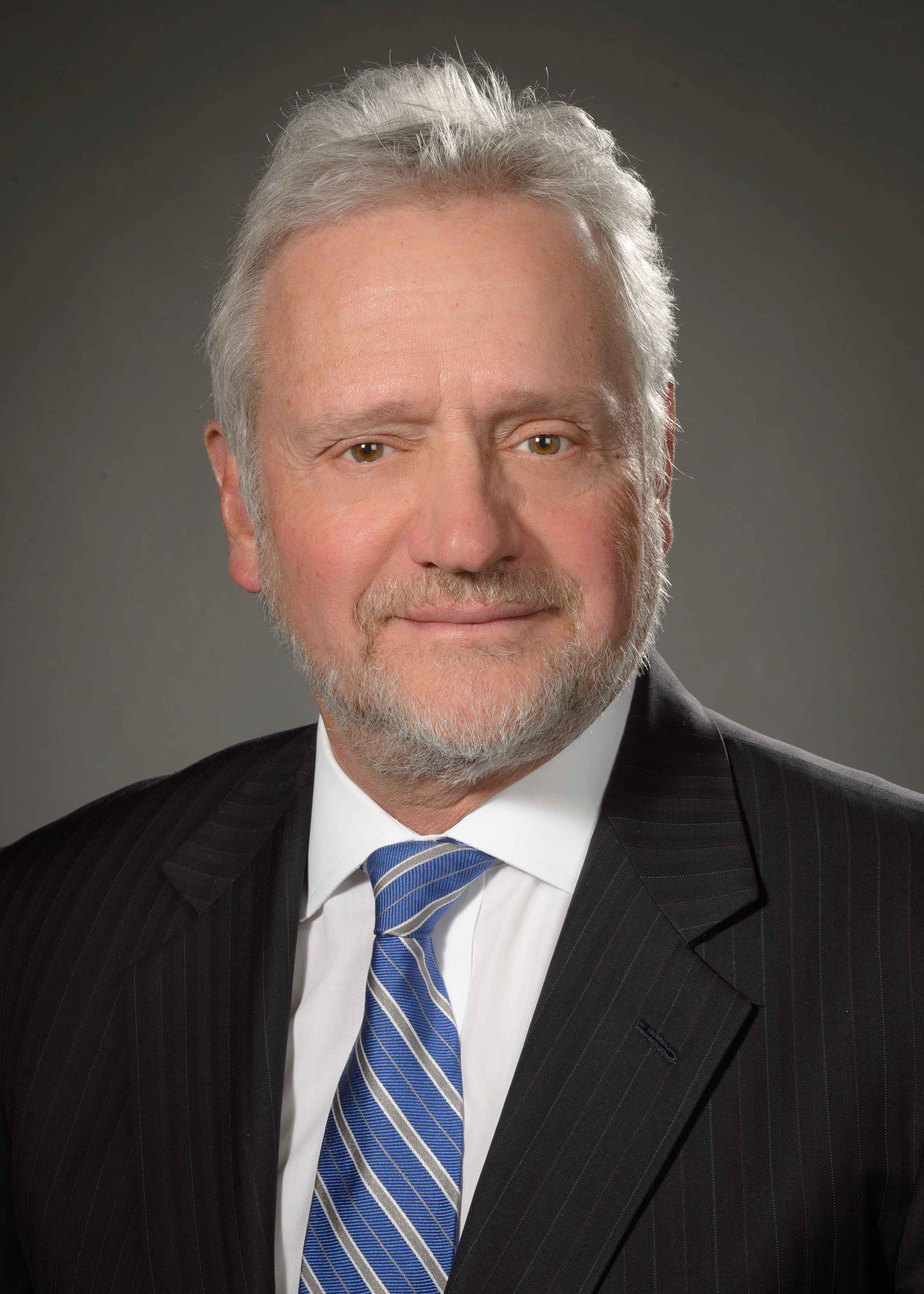 Alessandro Bellucci, MD, wearing a blue and grey tie